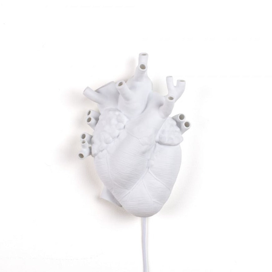 Heart is a brave and extravagant wall lamp. It resembles a real human heart. Warm light rays come out of veins and arteries, which have different diameters. It creates an incredibly cozy and romantic atmosphere. It was made entirely of white porcelain. It will find itself in every modern interior. In addition, it also has the function of an intriguing and unique decoration, irrelevant where it will hang.