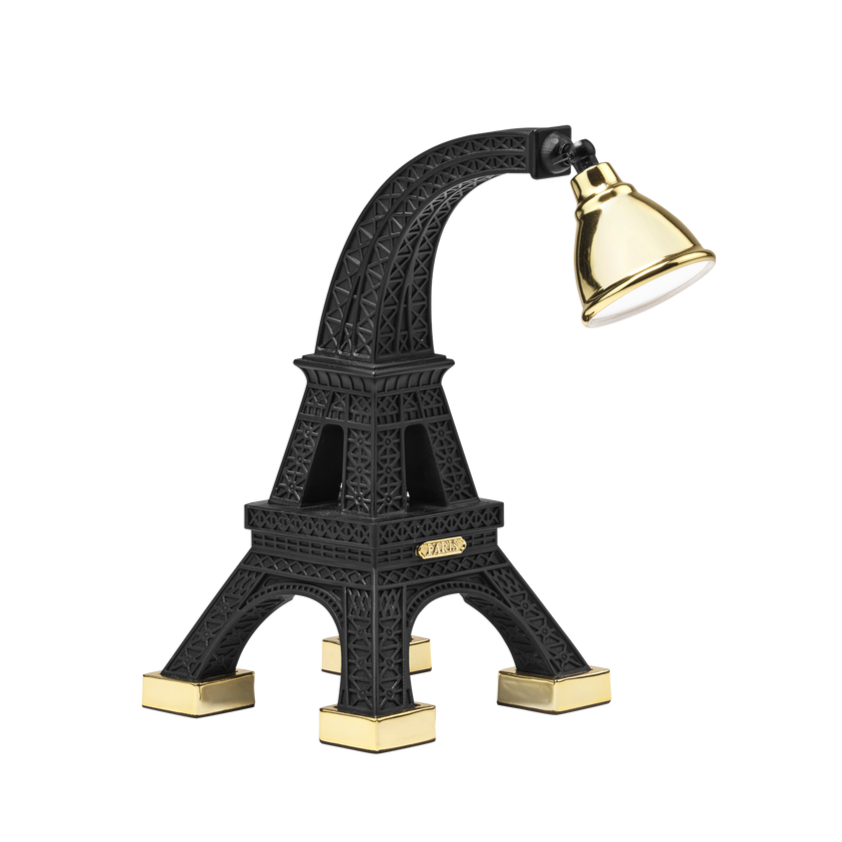 The Paris XS lamp from Qeebooo, designed by the Job studio, presents the miniature Eiffel Tower. It perfectly matches any bedside table, desk or reading table. The brass dome, placed on the black body, is fully adjustable, which makes reading easier. It is a model that will introduce