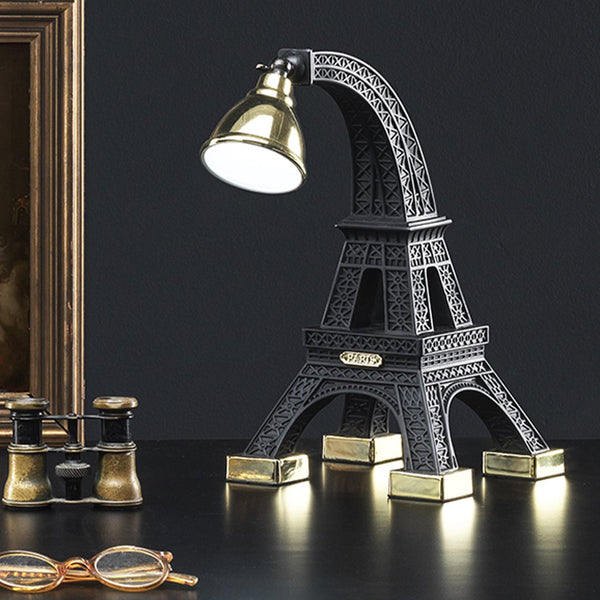 The Paris XS lamp from Qeebooo, designed by the Job studio, presents the miniature Eiffel Tower. It perfectly matches any bedside table, desk or reading table. The brass dome, placed on the black body, is fully adjustable, which makes reading easier. It is a model that will introduce