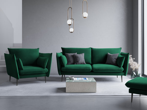 green armchair with a black base