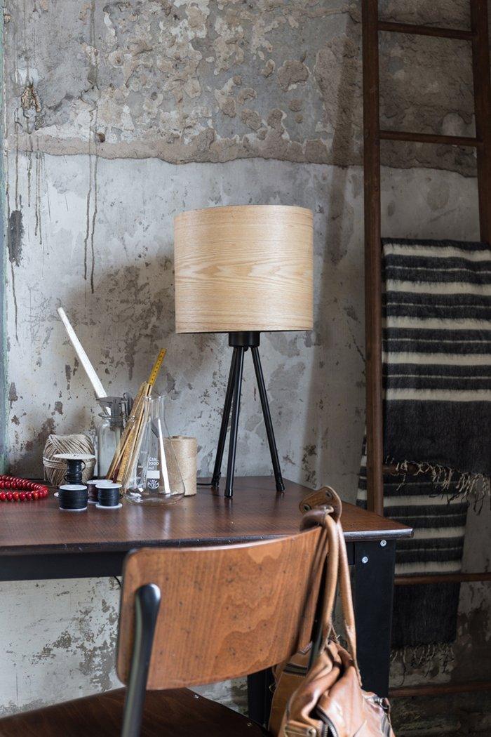 The Woodland table lamp is a retro style in a completely new version. The lamp has a lampshade with a classic, simple, regular shape. The lampshade was made of ash veneer, which distracts the light and spreads a warm and pleasant atmosphere. Veneer is flexible enough and can be formed in such calm and regular shapes.